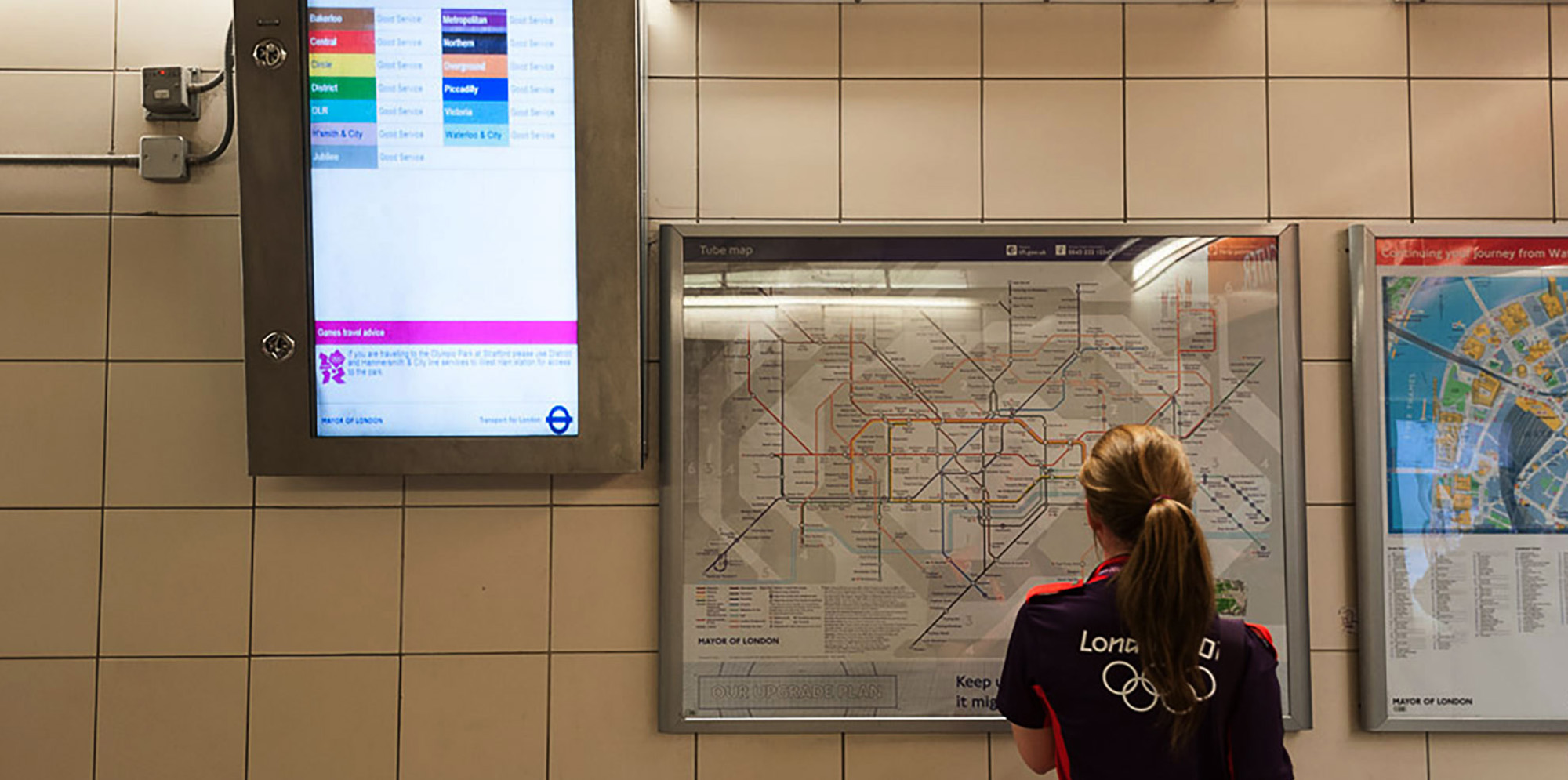 Person looking at London transit map