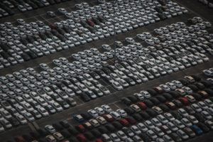 Rows of vehicles parked in a parking lot
