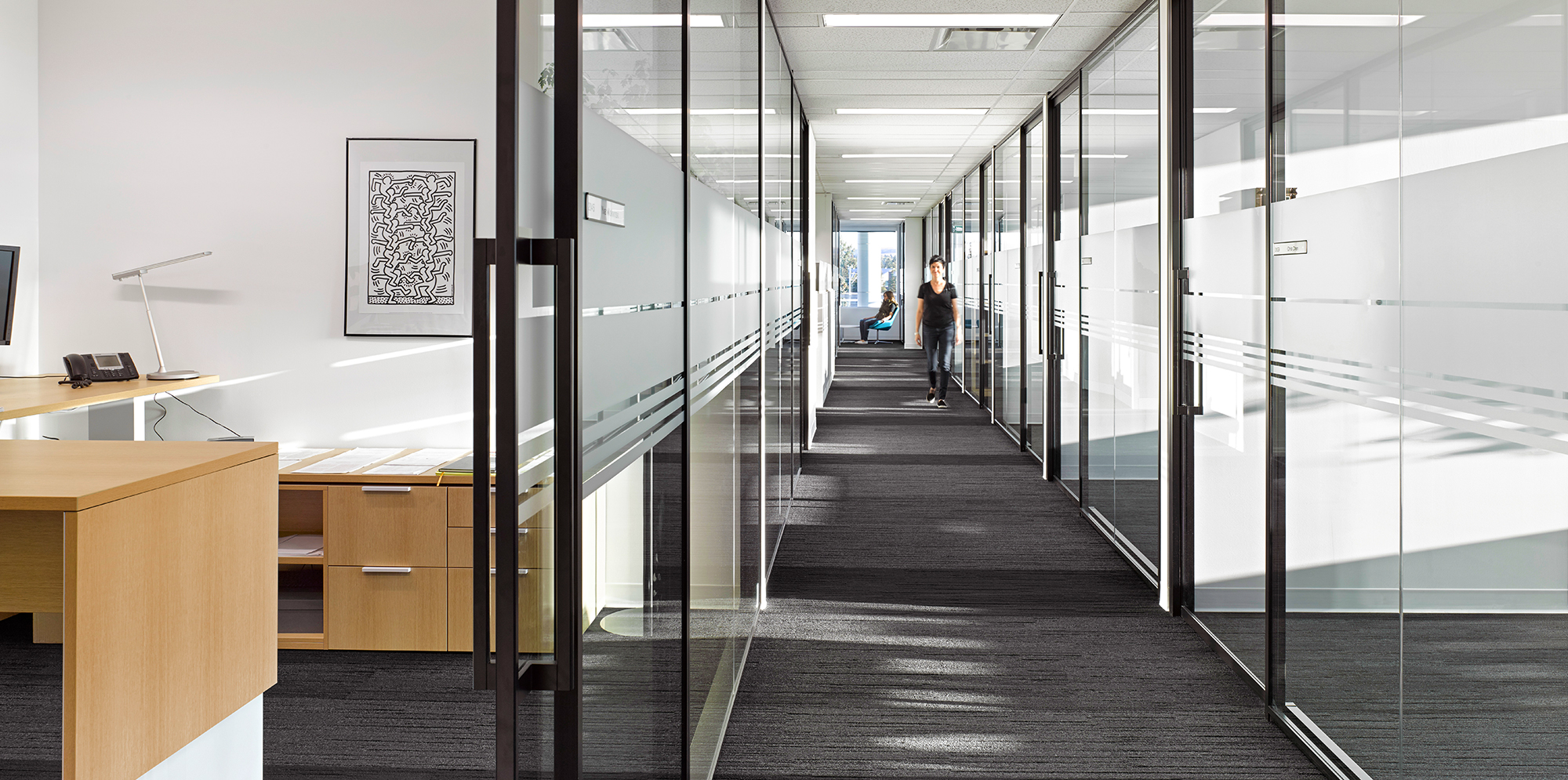 Hallway with multiple offices inside CMG Headquarters, designed by IBI Group