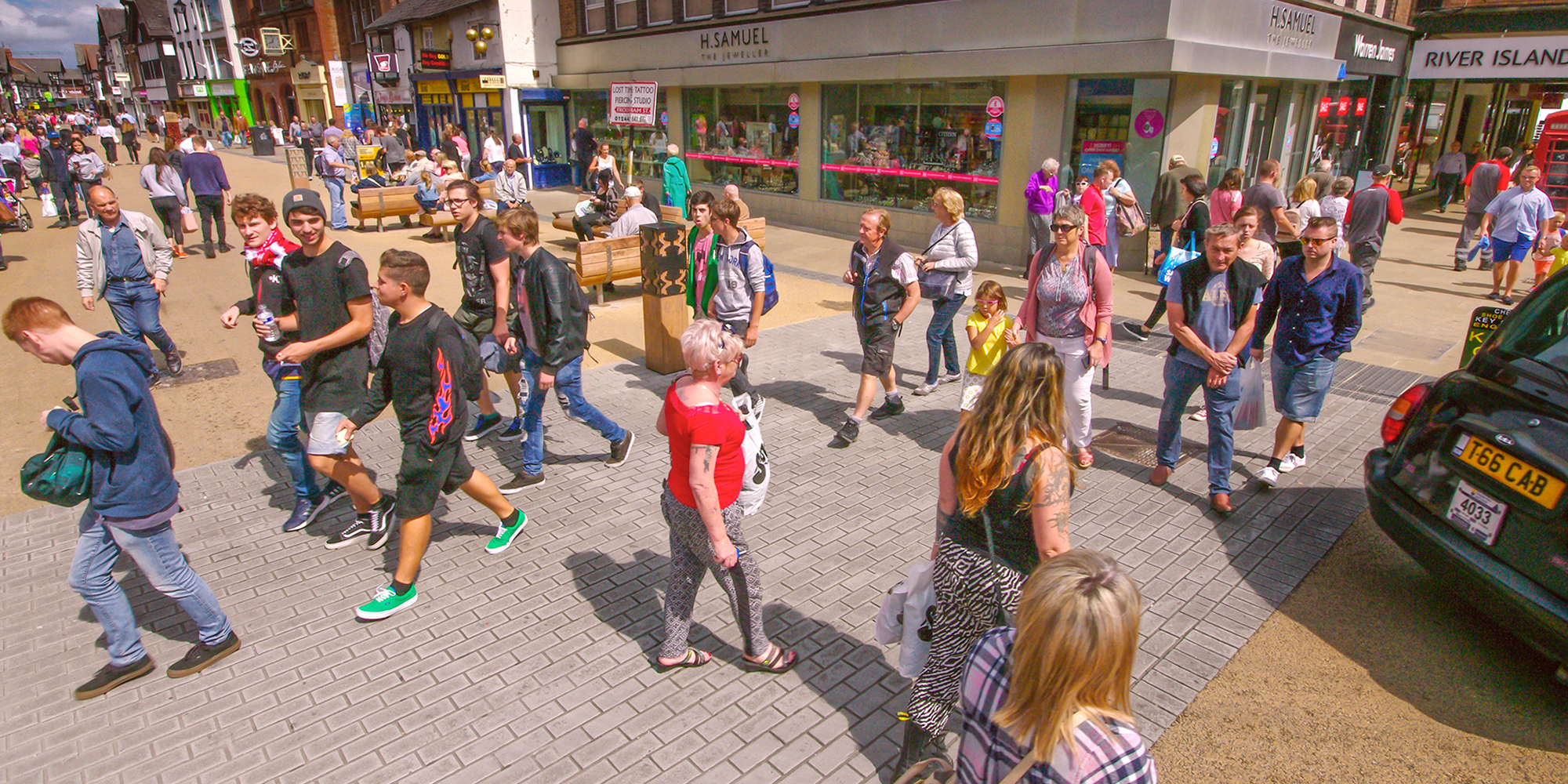 People walking through Frodsham Street Public Realm Chester, UK