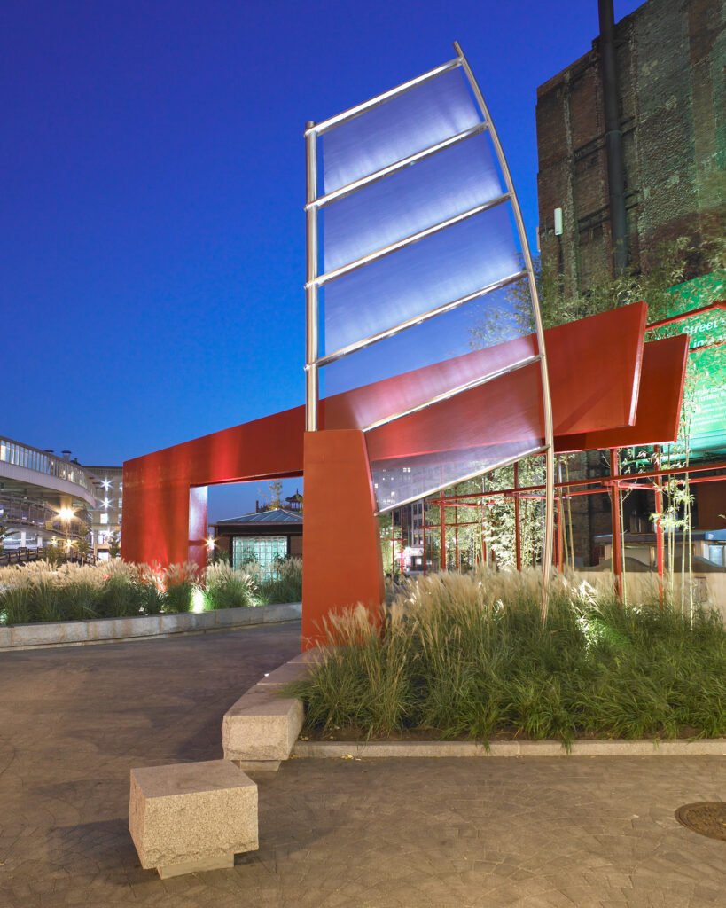 Chinatown Park's contemporary red steel gateway serves as counterpoint to the traditional gate at Beach Street