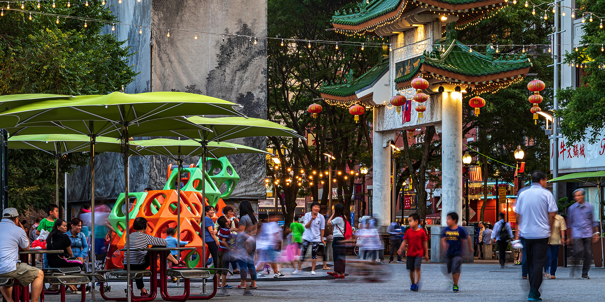 People walking through Chinatown park