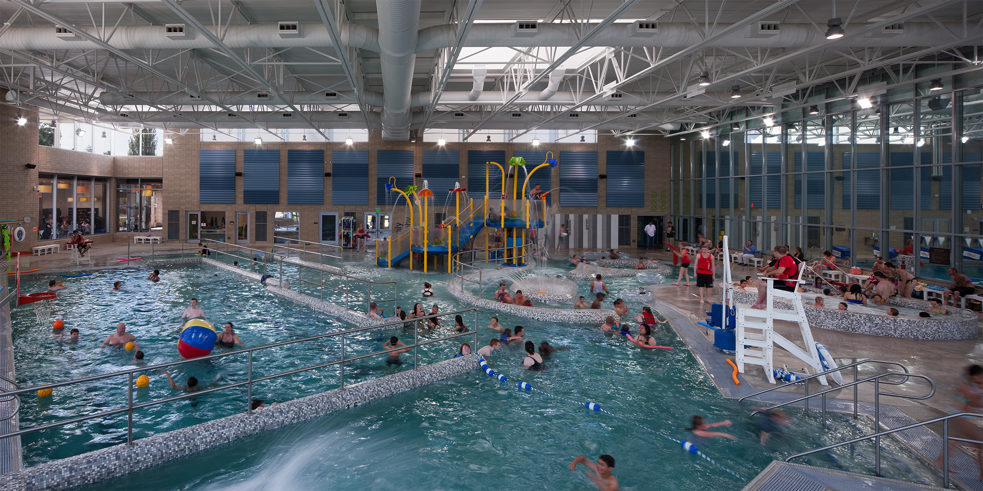 People swimming inside community pool at Snohomish Aquatic Center