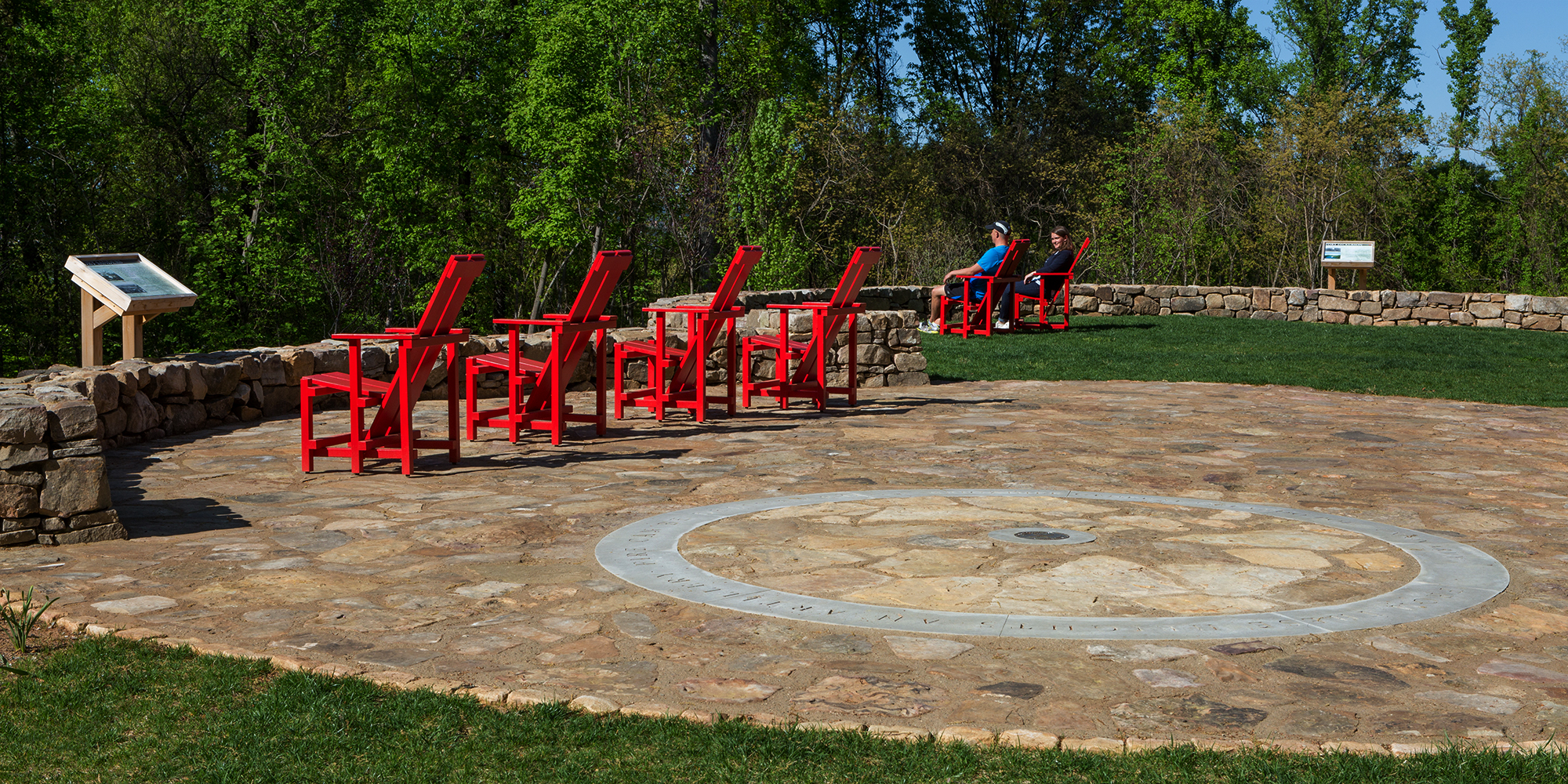 Seating area with red lawn chairs at High Ground Park