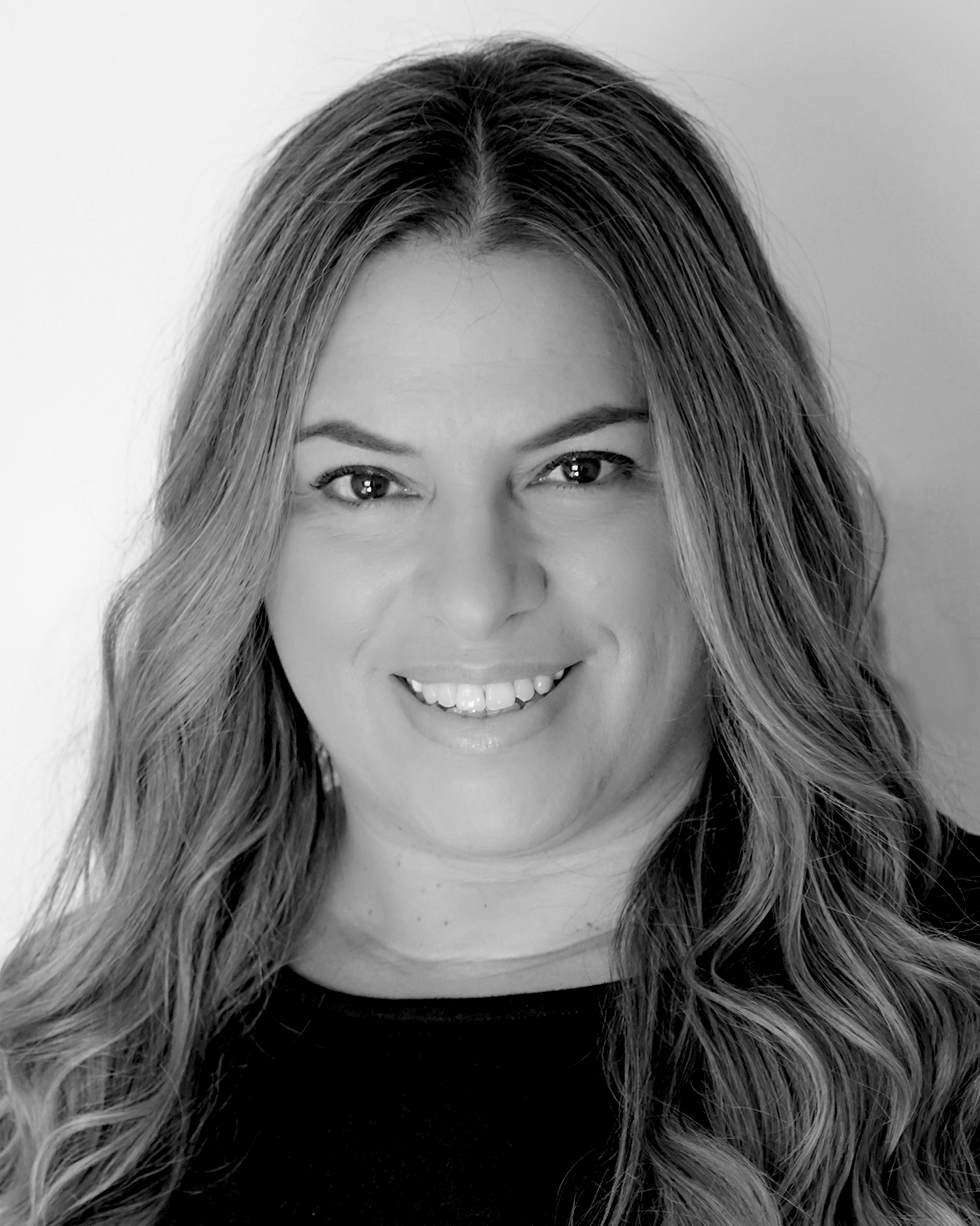Headshot of Carla Queiroz